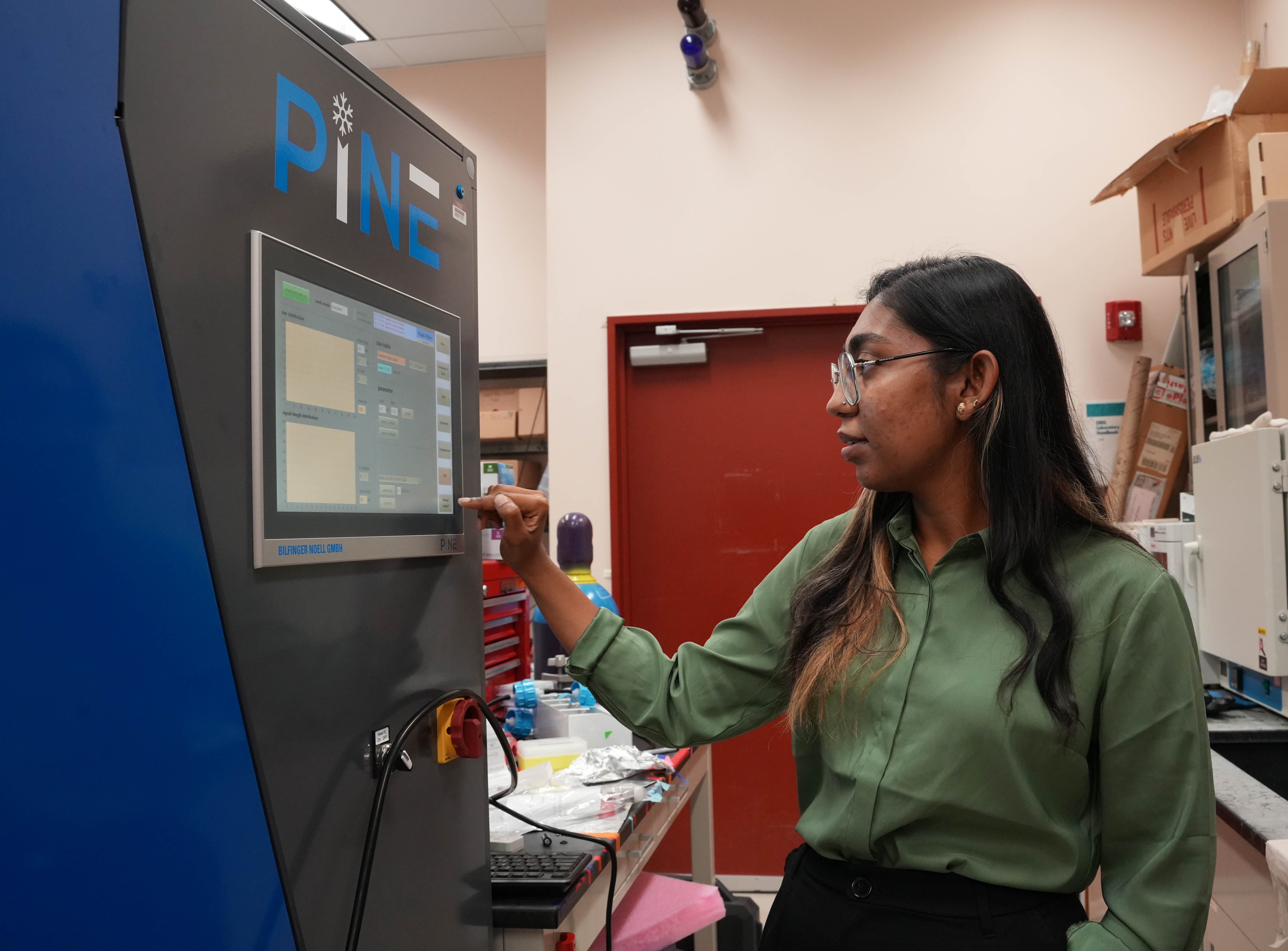 Oyshi Taluker works with the Portable Ice Nucleation Experiment resource in the Environmental Molecular Sciences Laboratory.
