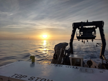 view of sunset from boat on ocean