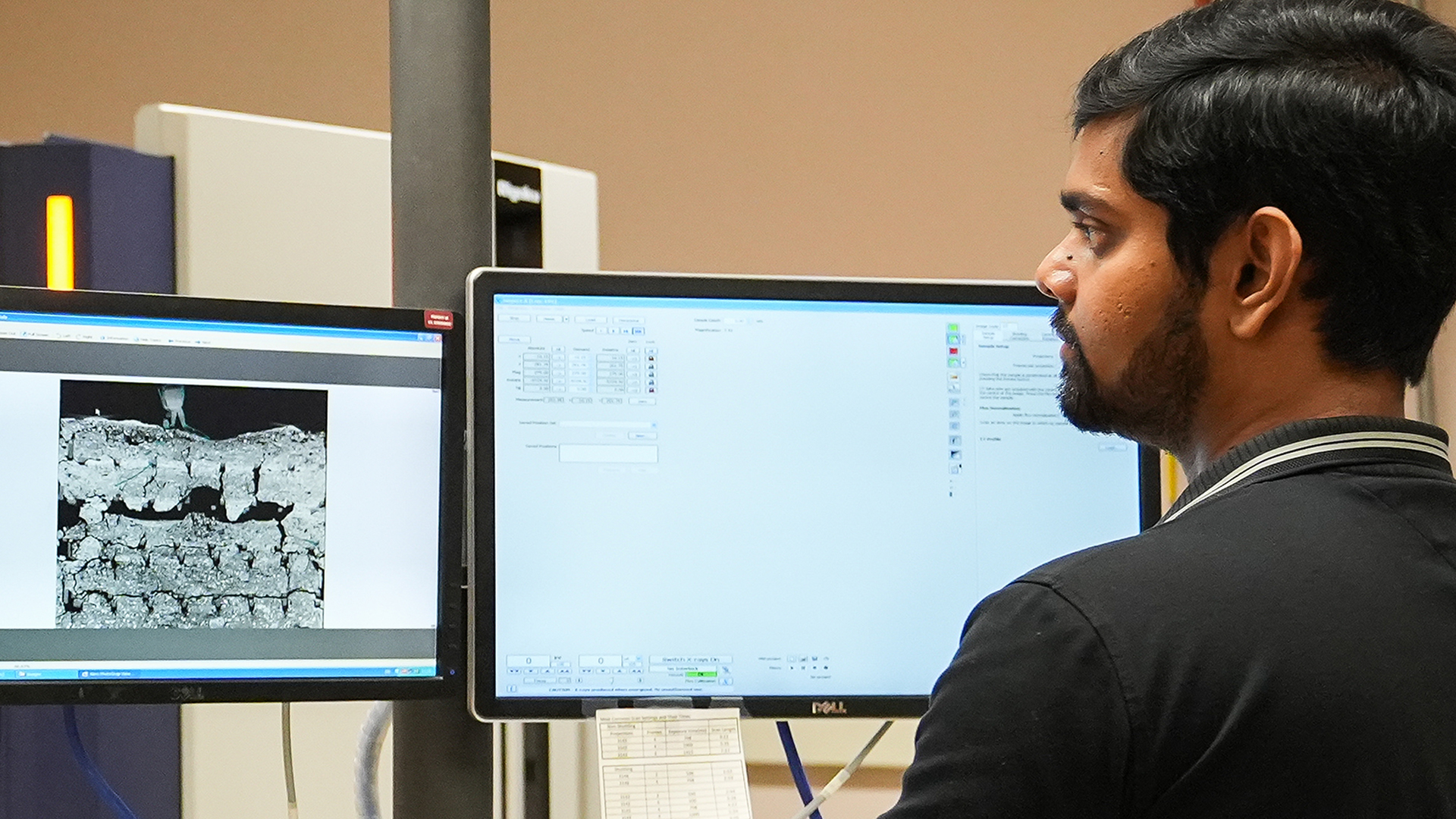 Photo of researcher Hasitha Wijesuriya working with lab equipment.