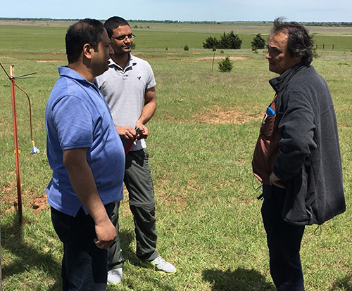 Image of Laskin, China, and Gourihar standing in a field