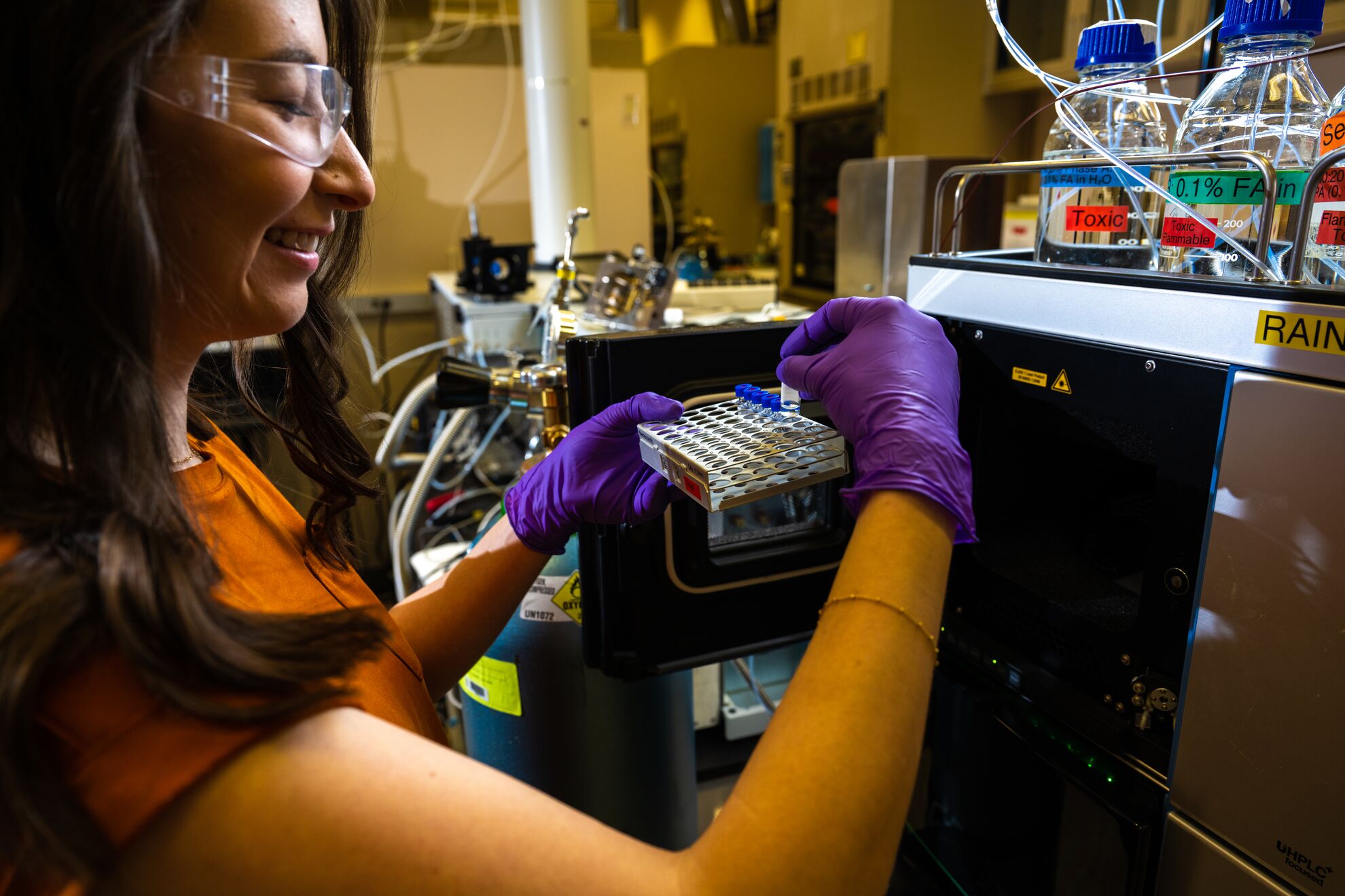 Researcher work with a liquid chromatography-mass spectrometer