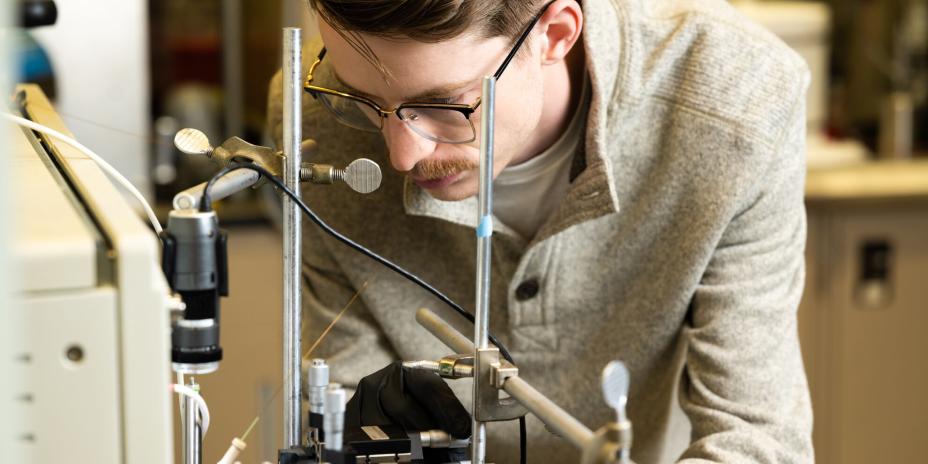 Researcher Gregory Vandergrift works with the NanoDESI instrument in a laboratory