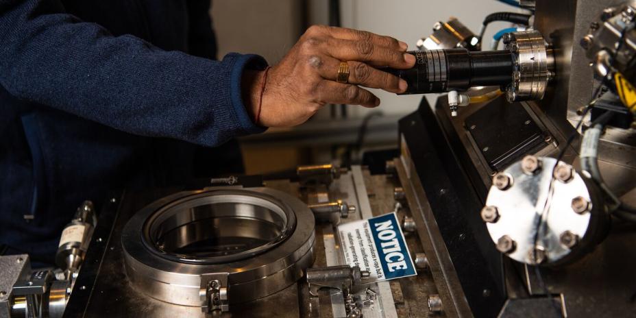 Scientist uses helium ion microscope at the Environmental Molecular Sciences Laboratory