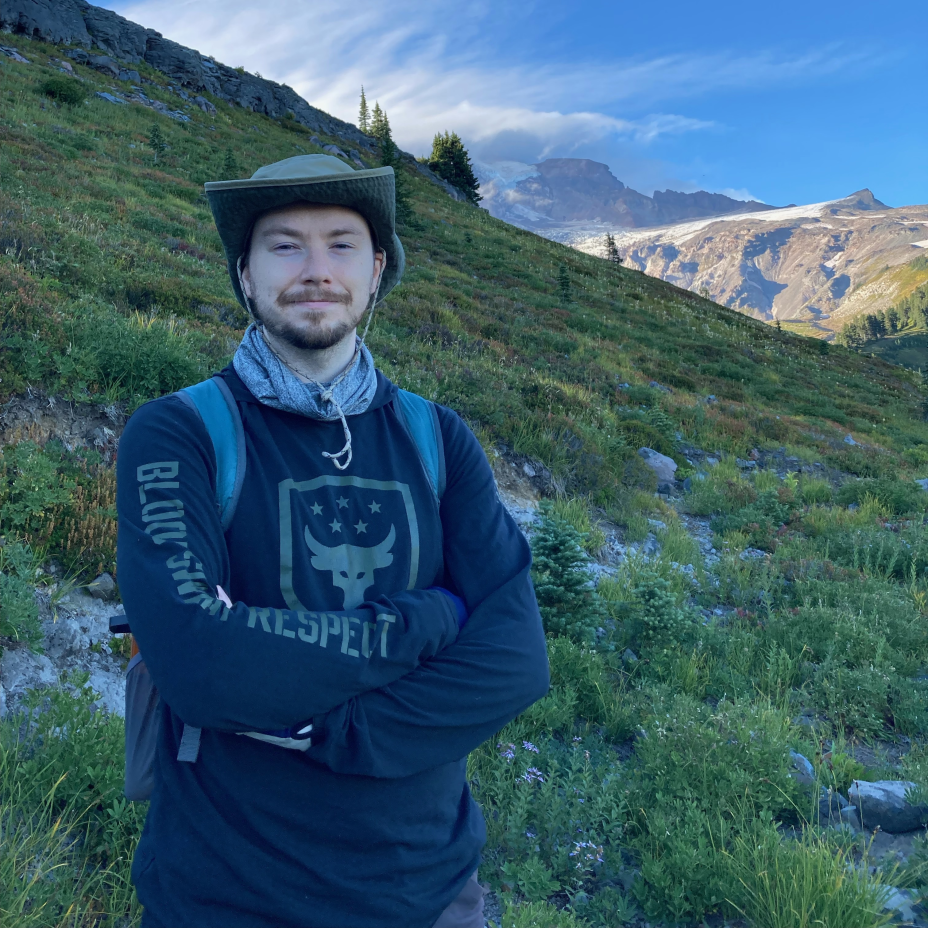 August George stands on a mountainside
