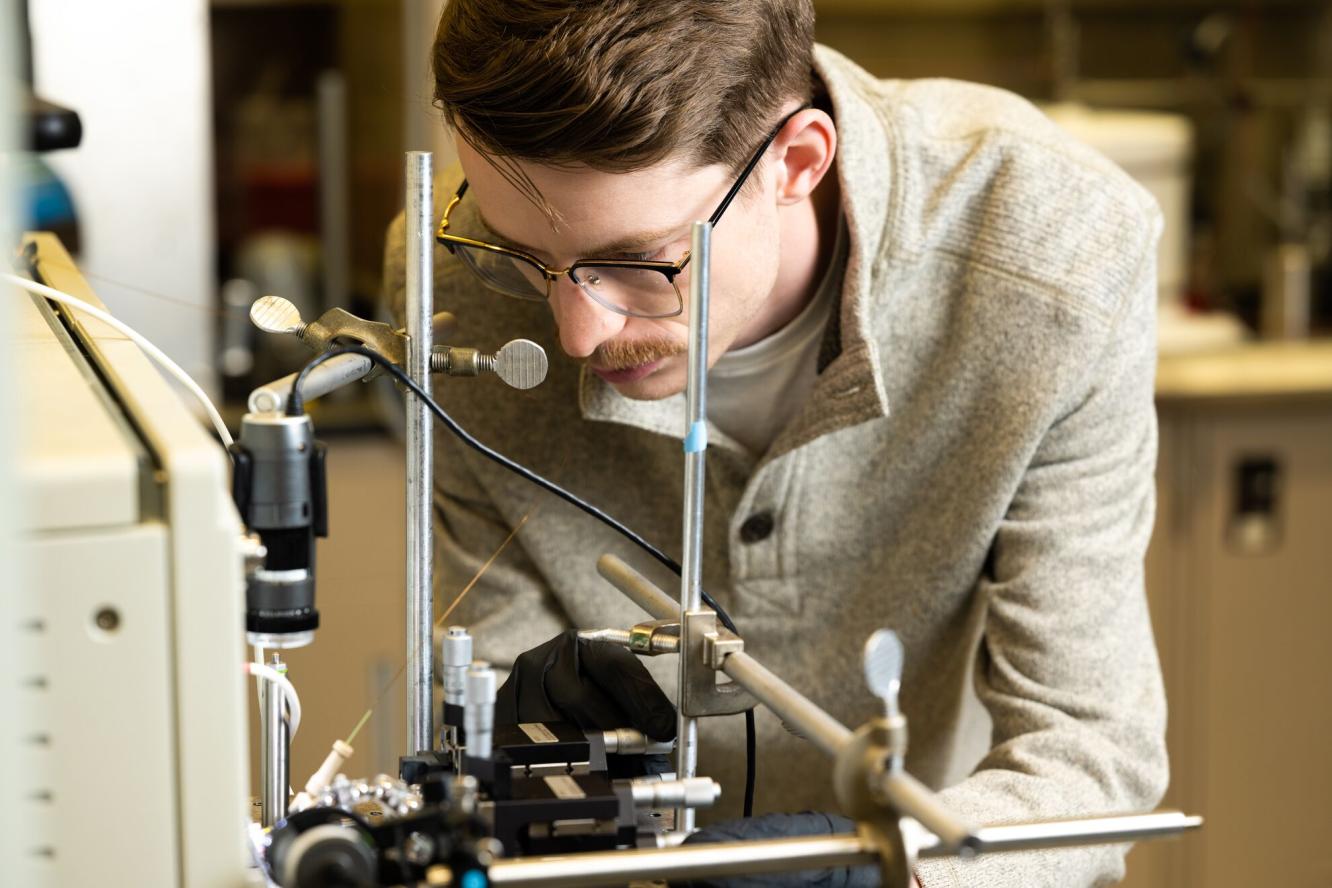 Researcher Gregory Vandergrift works with the NanoDESI instrument in a laboratory