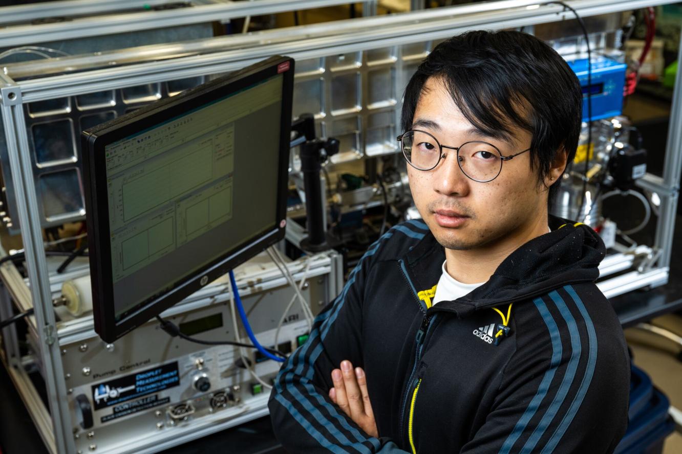 Zezhen (Jay) Cheng sits by a computer at the Environmental Molecular Sciences Laboratory