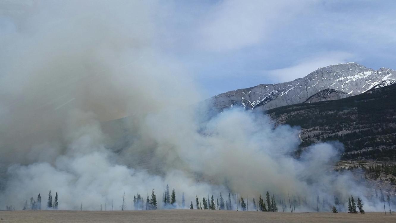 Mountains with rising smoke