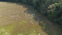 grassy field with experimental equipment