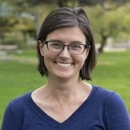 photo of woman with glasses and short brown hair 