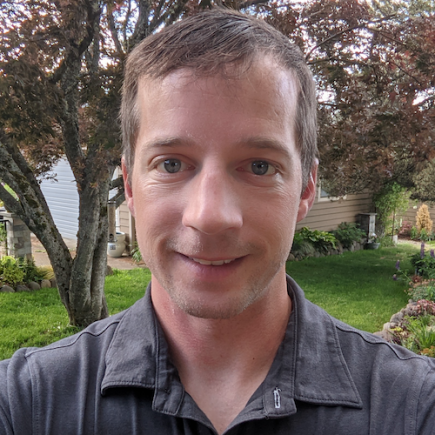 photo of smiling man in a polo shirt